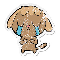 distressed sticker of a cute cartoon dog crying