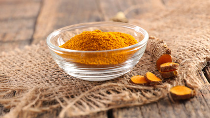 curcuma on wood background