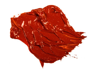 smear of red oil paint on a white background.