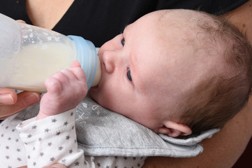 baby with a bottle of milk