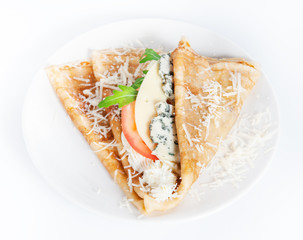 Thin delicious pancake with four types of cheese on white