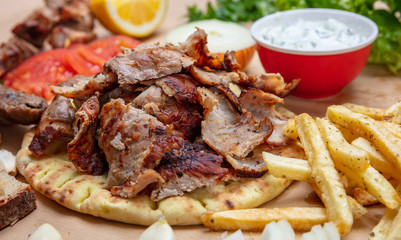 Shawarma, gyros pita. Traditional turkish, greek meat food on pita bread