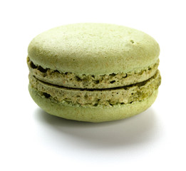 green macaroon on a white background