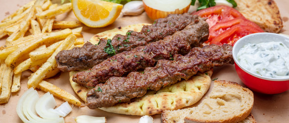 Kebab, traditional turkish, greek meat food on pita bread, top view