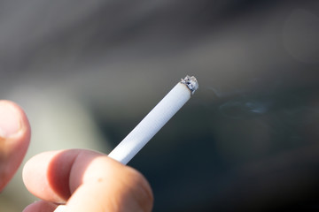 man smoking a cigarette cancer caucasian close up copy .