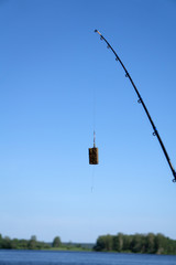 Feeder for fishing in weight forty gramme with swivel isolated on white. Clipping path included.