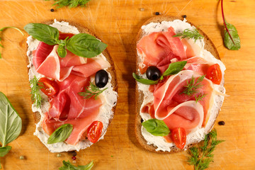 bread with cheese cream and prosciutto ham
