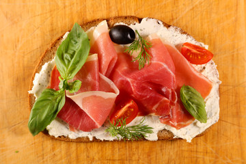 bread with cheese cream and prosciutto ham
