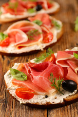 bread with cheese cream and prosciutto ham