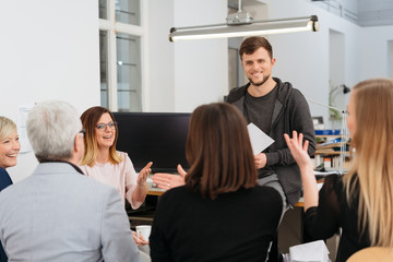 Fototapeta premium Members of an audience laughing and gesturing