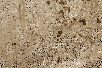 Wet plastic transparent old wrap texture in brown tone.
