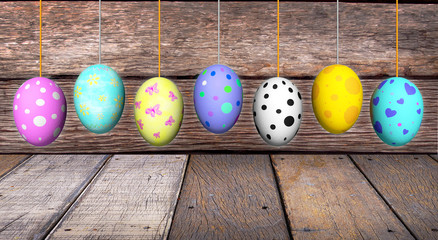 Pastel color on easter eggs which hang on rope wood board background,3D rendering