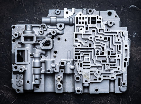 Background and pattern of old metal parts of the gearshift box. Hydro-brain transmissions and gears.