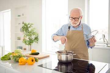 Close up photo grey haired he his him grandpa waiting guests cooking favorite family dish trying...