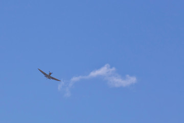 Military plane and cloud in sky above the Atherton Tablelands in Tropical North Queensland, Australia
