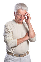 Portrait of thinking senior man on white background