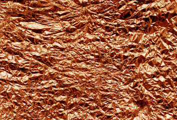 Metal foil texture in orange color.