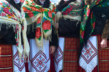 Women in Belarusian folk costumes. Embroidered dresses and painted scarves.