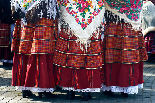 Women in Belarusian folk costumes. Embroidered dresses and painted scarves.