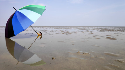 Colorful umbrella and reflection