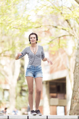 Young beautiful student outdoors in campus