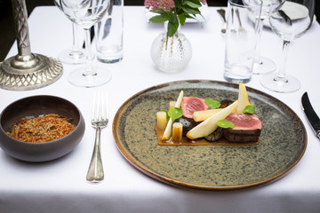 Fine dining plate with glass of red wine