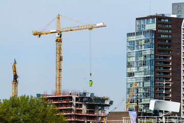 concept construction, crane builds a skyscraper