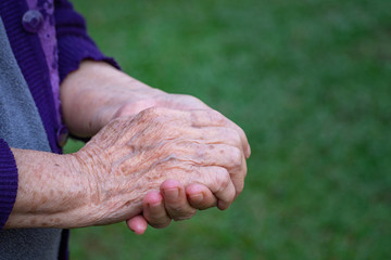 Close-up Of wrinkled hands elderly woman.