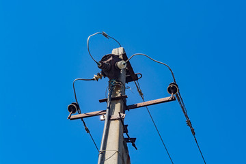 Old power line against the blue sky