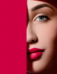 Meubelstickers Schoonheidssalon Plump bright red lips in red paper frame. Young model face. Close up beauty photo. Geometry and minimalism. Creative fashion makeup, beautiful woman, clear skin