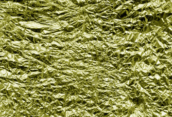 Metal foil texture in yellow color.