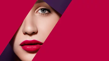Afwasbaar Fotobehang Schoonheidssalon Plump bright red lips in red and violet paper frame. Young model face. Close up beauty photo. Geometry and minimalism. Creative fashion makeup, beautiful woman, clear skin