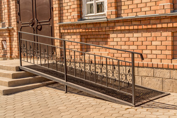 Metal ramp for disabled people, summer day