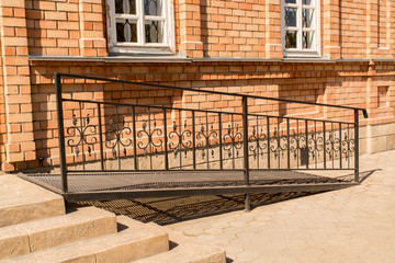 Metal ramp for disabled people, summer day