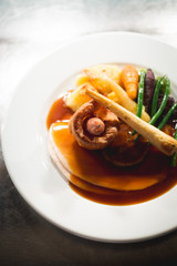 toad in the hole, with gravy and seasonal vegetables