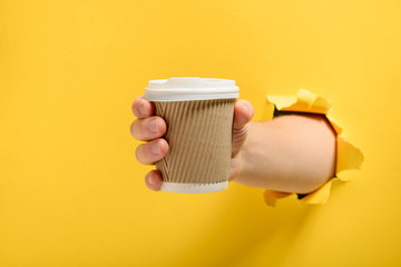 Hand taking a cup