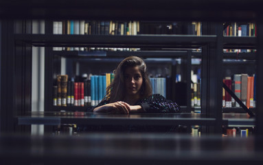 young woman in the city have fun in a diktionary Library colorated in Berlin by #tigerraw