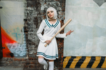 Anime girl with baseball bat in abandoned factory