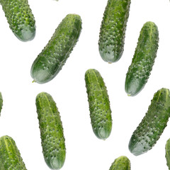 Heap of whole cucumbers isolated on white. Top view. Vegetable background. Seamless pattern. Food texture.