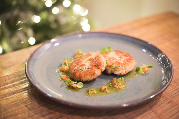 Thai fish cakes on wooden table