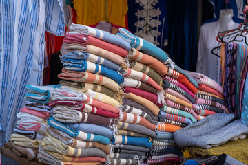 A typical market stall selling a range of clothing and trinkets to tourists in Marrakech