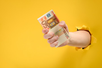 Hand giving banknotes