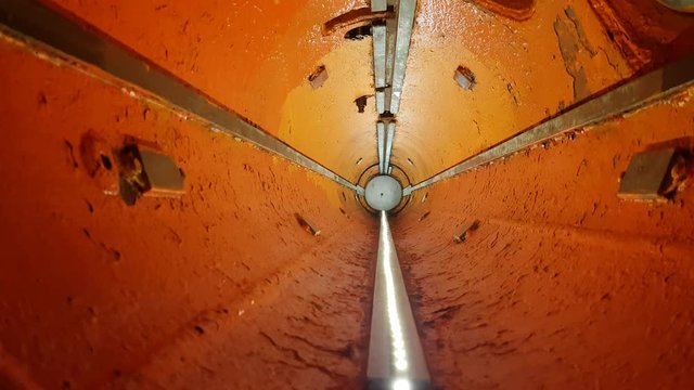 Motion in red painted tube