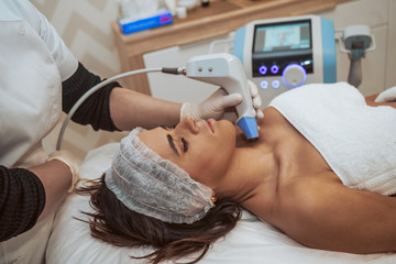 Woman doing cosmetic treatments