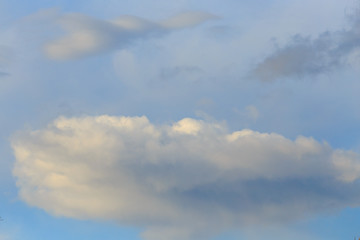 Clouds after rain before sunset as a background