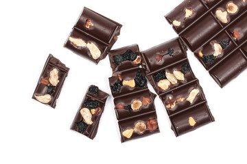 Chocolate bars with blueberries, hazelnuts and almonds isolated on white background