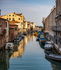 Parked boats. Beautiful Canal in Venice Italy