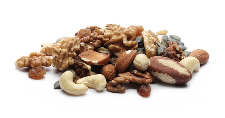 Organic snack, food mix, dried raisins, almonds, pumpkin seeds, indian and brazilian walnuts isolated on white background