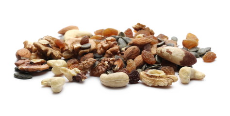 Organic snack, food mix, dried raisins, almonds, pumpkin seeds, indian and brazilian walnuts isolated on white background