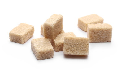 Brown cane sugar cubes isolated on white background